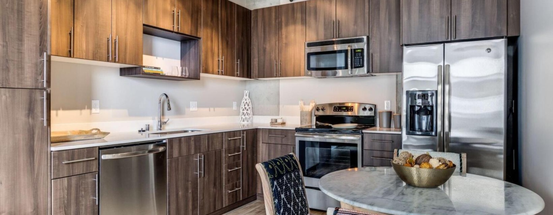 a kitchen with wooden cabinets