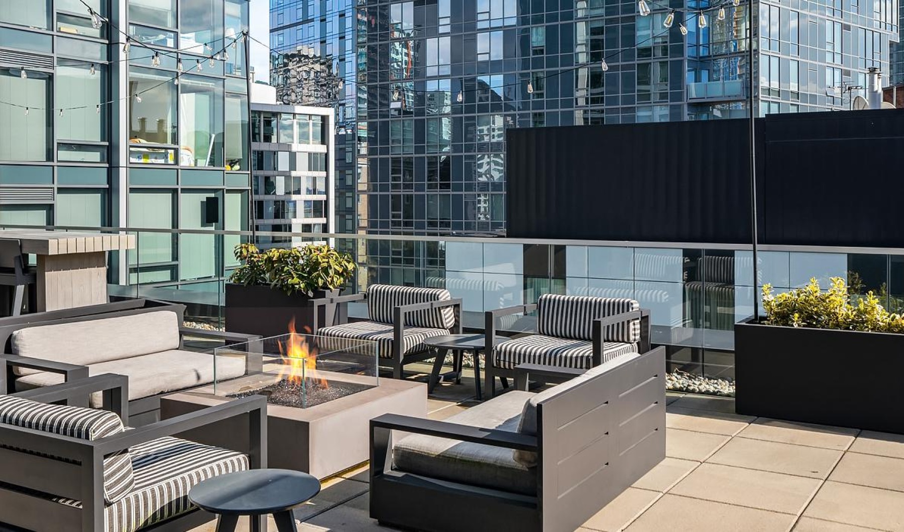 a rooftop with benches and tables